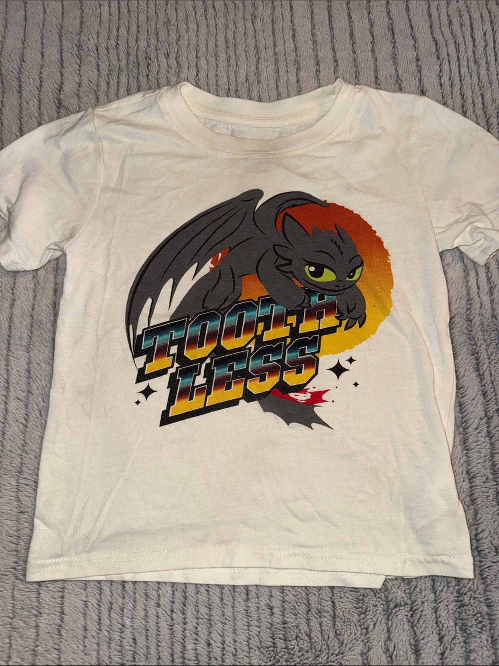Dreamworks White Short-Sleeve Toothless Graphic Tee with Orange Accent
